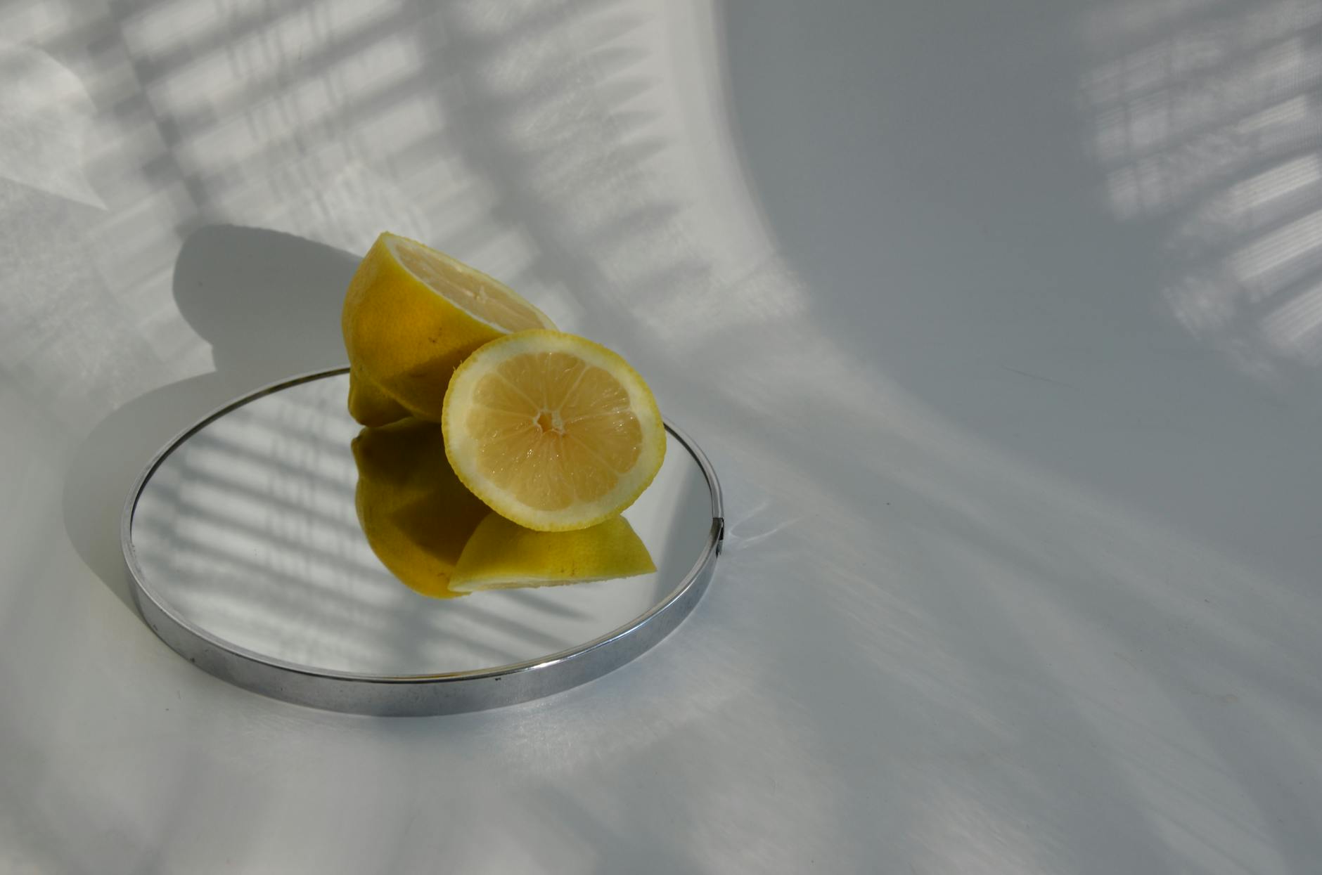A hand gently holding an orange vibrator against a minimalist purple background, symbolizing self-care and bodily autonomy